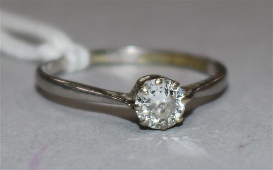 A white metal and solitaire diamond ring, size Q.